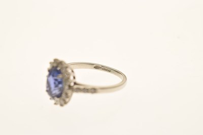 Lot 20 - Sapphire and diamond platinum cluster ring