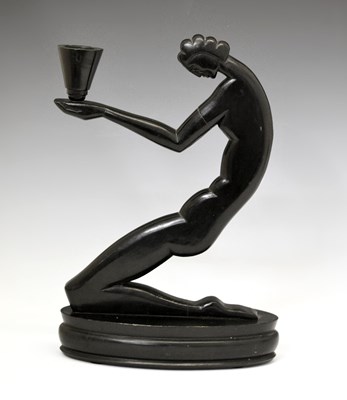 Lot 453 - Art Deco carved ebonised wood figural candlestick