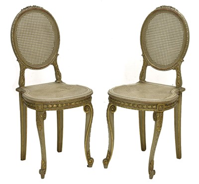 Lot 442 - Pair of painted and parcel gilt Louis XVI style side chairs