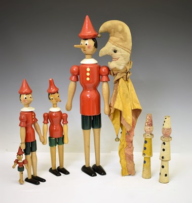Lot 312 - Group of painted wooden Pinocchio dolls, etc