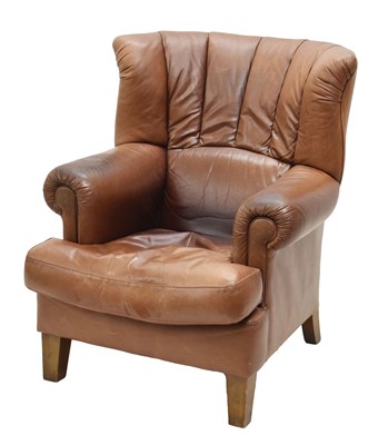 Lot 723 - Tan leather wingback armchair