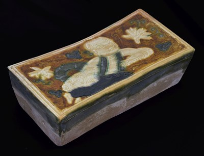 Lot 619 - Chinese sancai glazed terracotta pillow or neck rest