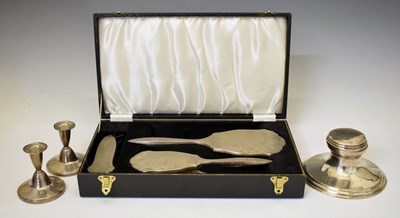 Lot 302 - George V silver capstan inkwell, Birmingham 1930, a pair of Elizabeth II low candlesticks, etc