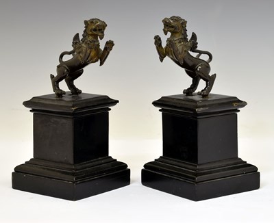 Lot 227 - Pair of 19th century Burmese bronze mounts formed as chinthe or guardian lions