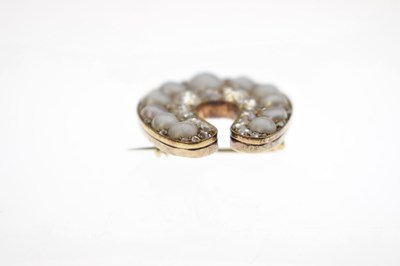 Lot 31 - Late Victorian diamond and pearl horseshoe brooch