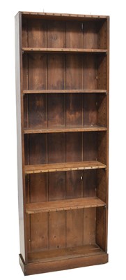 Lot 573 - Late 19th century stained pine narrow open bookcase with five shelves