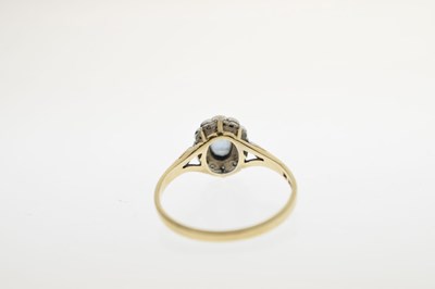 Lot 19 - Modern 9ct gold and sapphire cluster ring