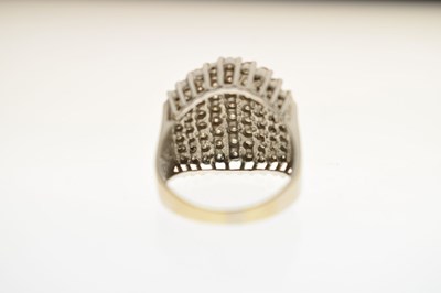 Lot 18 - Multi stone diamond white metal dress ring
