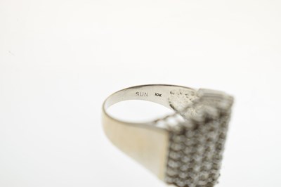 Lot 18 - Multi stone diamond white metal dress ring