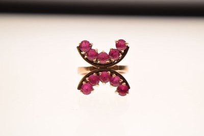 Lot 23 - 9ct gold ring set ten rubies in double 'C' formation
