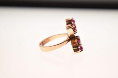 Lot 23 - 9ct gold ring set ten rubies in double 'C' formation