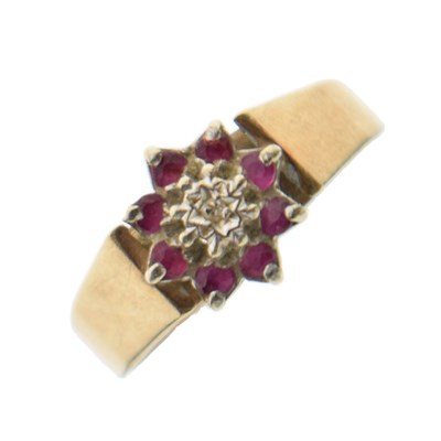 Lot 31 - Ruby and diamond 9ct gold cluster ring