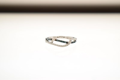 Lot 8 - White and blue diamond 9ct white gold half eternity ring