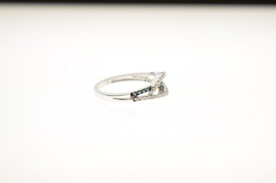 Lot 8 - White and blue diamond 9ct white gold half eternity ring