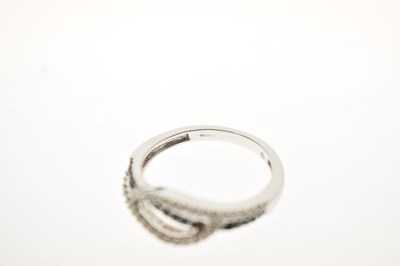 Lot 8 - White and blue diamond 9ct white gold half eternity ring