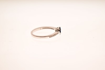 Lot 29 - White and blue diamond 9ct gold cluster ring