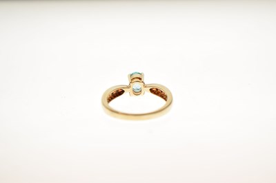Lot 37 - Blue topaz and white stone 9ct gold ring