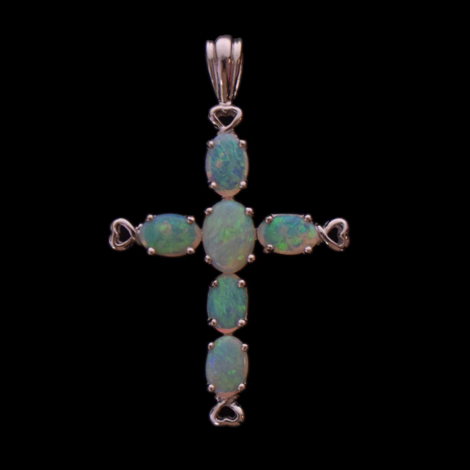 Lot 87 - Opal and 9ct white gold cross pendant