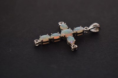 Lot 87 - Opal and 9ct white gold cross pendant
