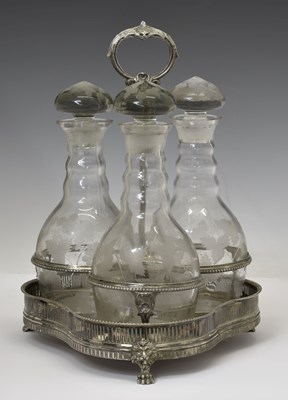 Lot 445 - Set of three etched glass decanters