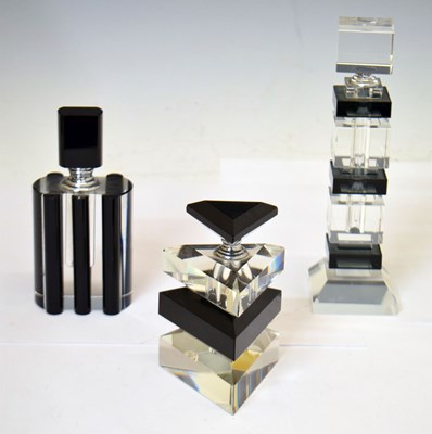 Lot 451 - Three 20th century glass scent bottles with black and white Art Deco style decoration