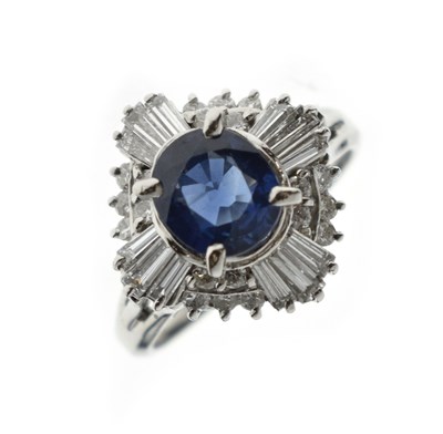 Lot 15 - Sapphire and diamond platinum cluster ring