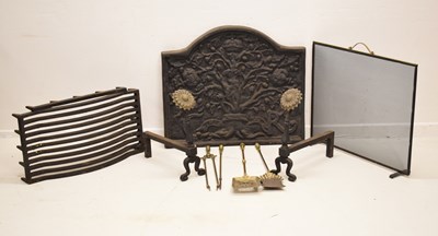 Lot 274 - Cast iron fire back, dog grate, andirons and brass companion set