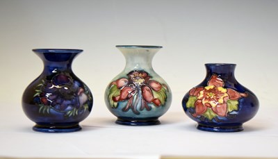 Lot 507 - Moorcroft - Three blue ground squat vases