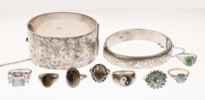 Lot 71 - Two silver bangles together with eight dress rings