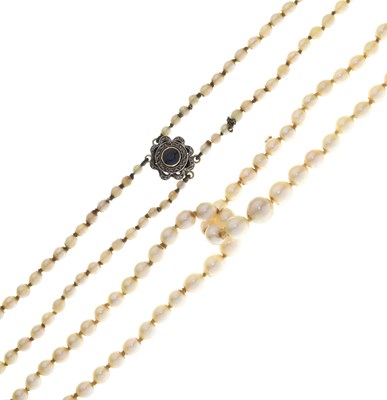Lot 43 - Edwardian graduated pearl double string necklace with sapphire set clasp