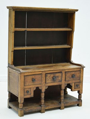 Lot 742 - Early to mid 19th century 'apprentice piece' inlaid oak 'potboard' dresser and rack