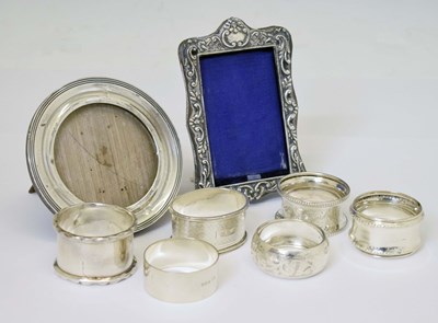 Lot 161 - Six silver napkin rings and two silver mounted photo frames