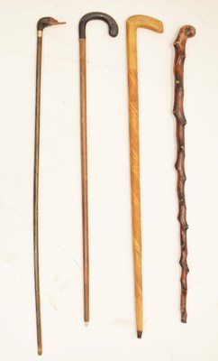 Lot 224 - Four assorted walking sticks and canes including goose head example