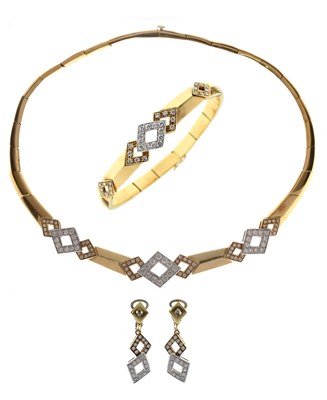 Lot 69 - Diamond 18ct yellow and white gold suite comprising necklace, bracelet, and earrings