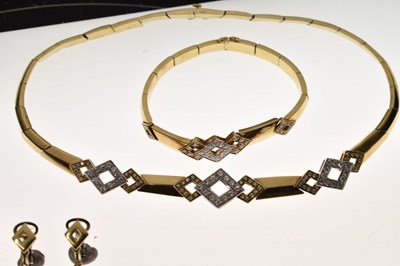 Lot 69 - Diamond 18ct yellow and white gold suite comprising necklace, bracelet, and earrings
