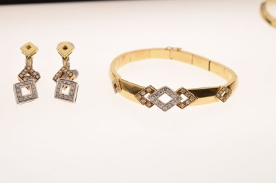 Lot 69 - Diamond 18ct yellow and white gold suite comprising necklace, bracelet, and earrings