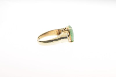 Lot 29 - Jade and diamond 14k yellow and white metal ring
