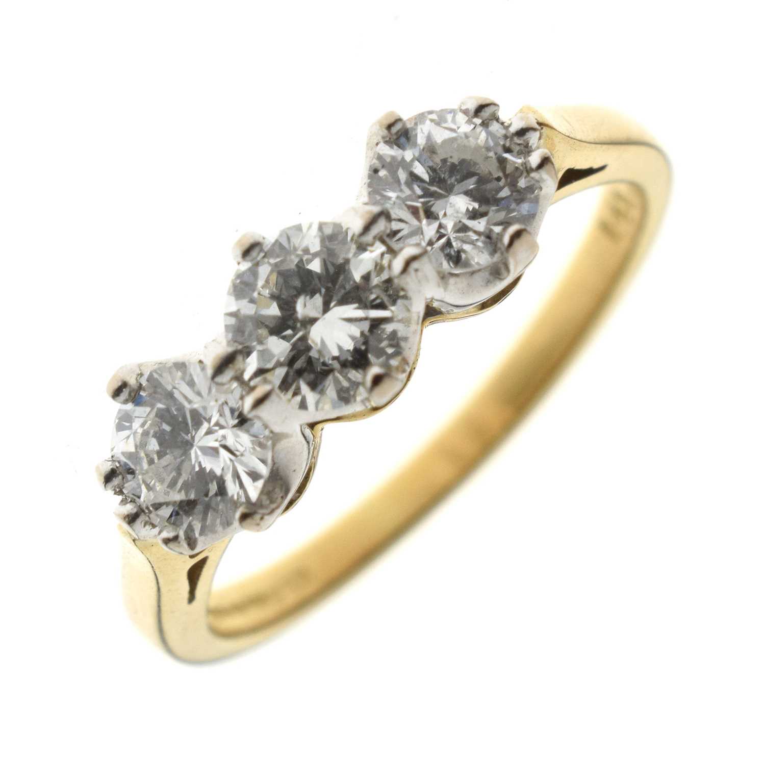 Lot 1 - Three stone diamond 18ct gold ring