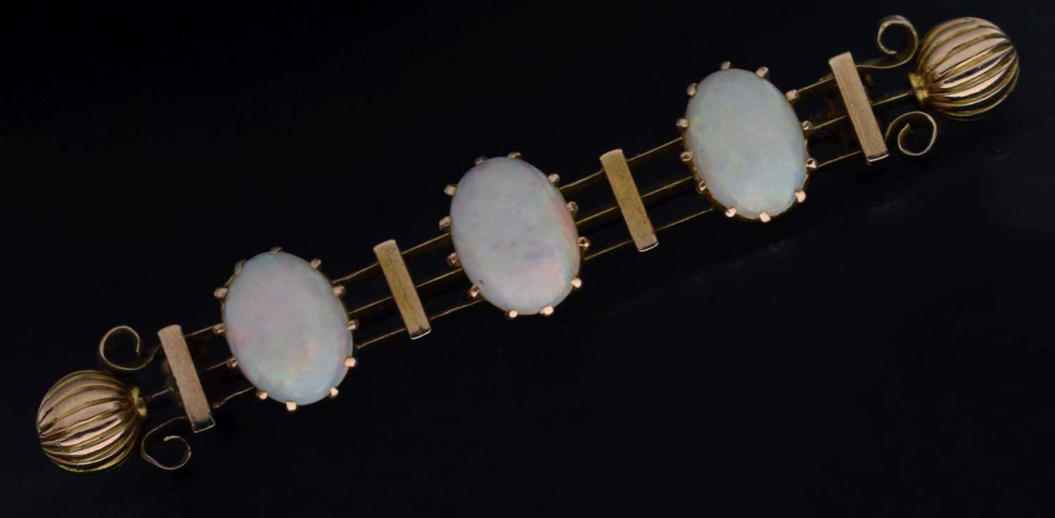 Lot 49 - Late 19th/early 20th century opal unmarked yellow metal bar brooch