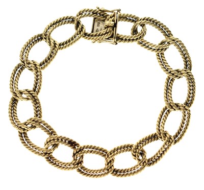 Lot 64 - Yellow metal double curb link bracelet, stamped 750