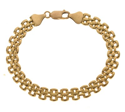 Lot 65 - Fancy link yellow metal bracelet, stamped '750 18K', the clasp stamped '375'
