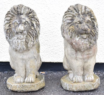 Lot 654 - Pair of composition garden statues of lions