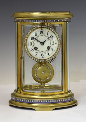 Lot 491 - Late 19th century French champleve enamel and brass oval four glass mantel or library clock