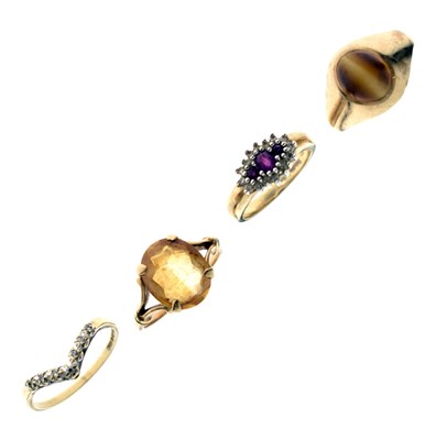 Lot 30 - Four gem-set dress rings