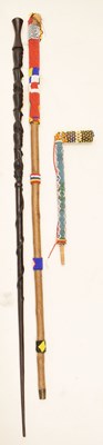 Lot 378 - African carved wood staff, beadwork pipe and walking stick