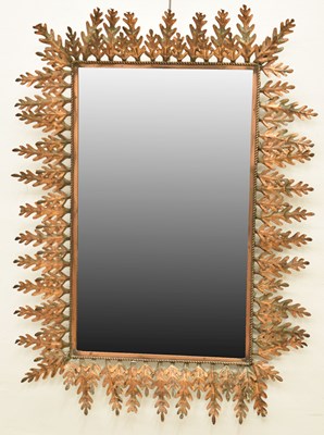 Lot 594 - Early 20th century copper wall mirror with double row leaf surround