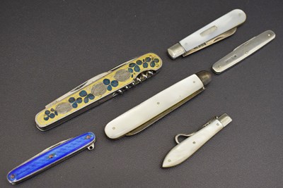 Lot 257 - Victorian silver folding button hook, two mother-of-pearl cased folding fruit knives, etc