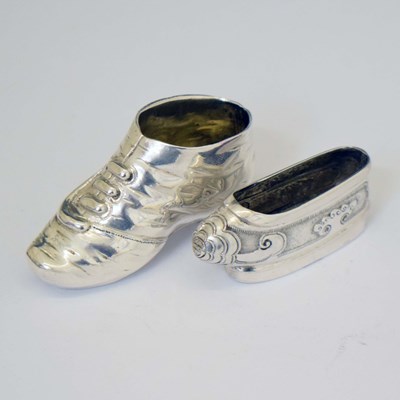 Lot 259 - A Chinese white-metal miniature slipper and a continental silver novelty pin cushion