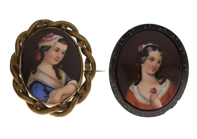 Lot 155 - Two painted porcelain oval brooches