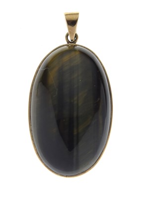Lot 43 - Tigers eye yellow metal pendant
